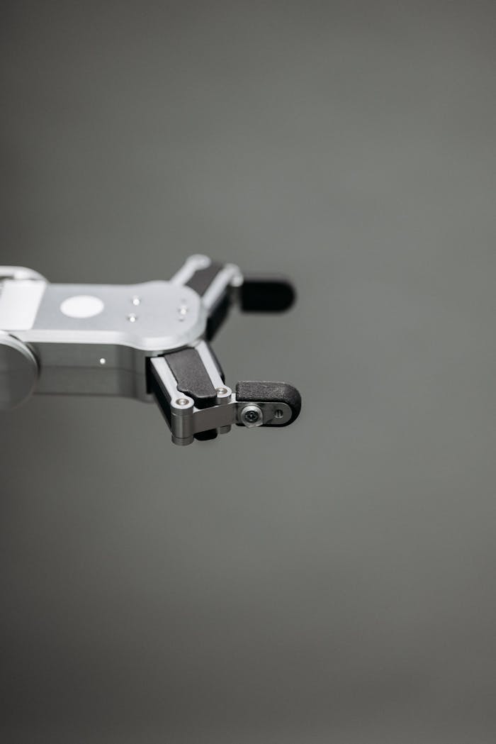 A detailed close-up of a robotic arm in grayscale, showcasing modern technology.